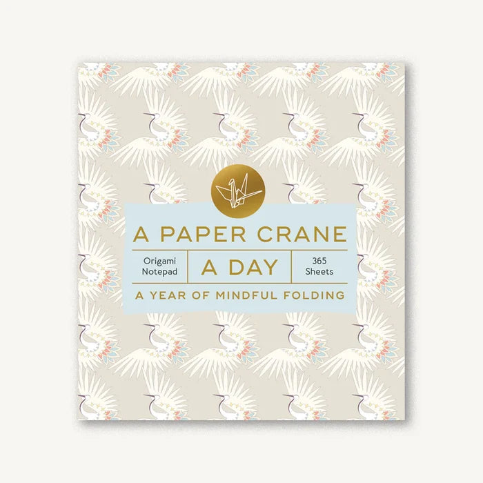 Notebook with paper crane design and text on a white background