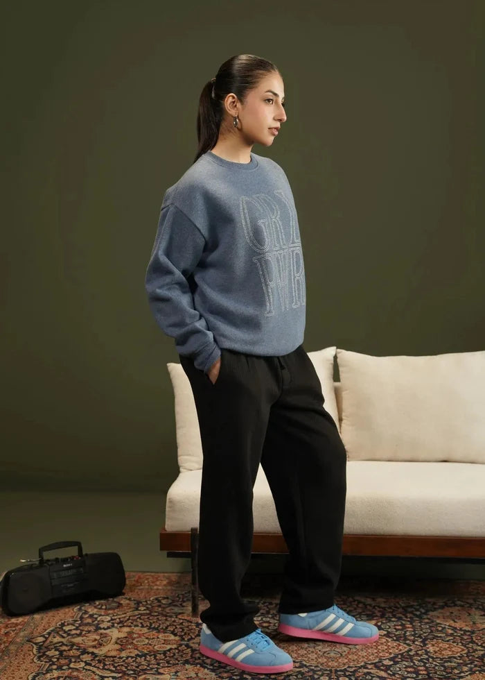 Blue knit crewneck sweatshirt with 'GRL' logo, side view, long sleeves