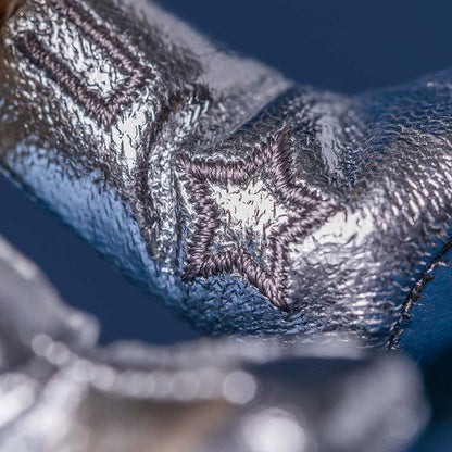 Close-up of a textured metallic surface with a star design.