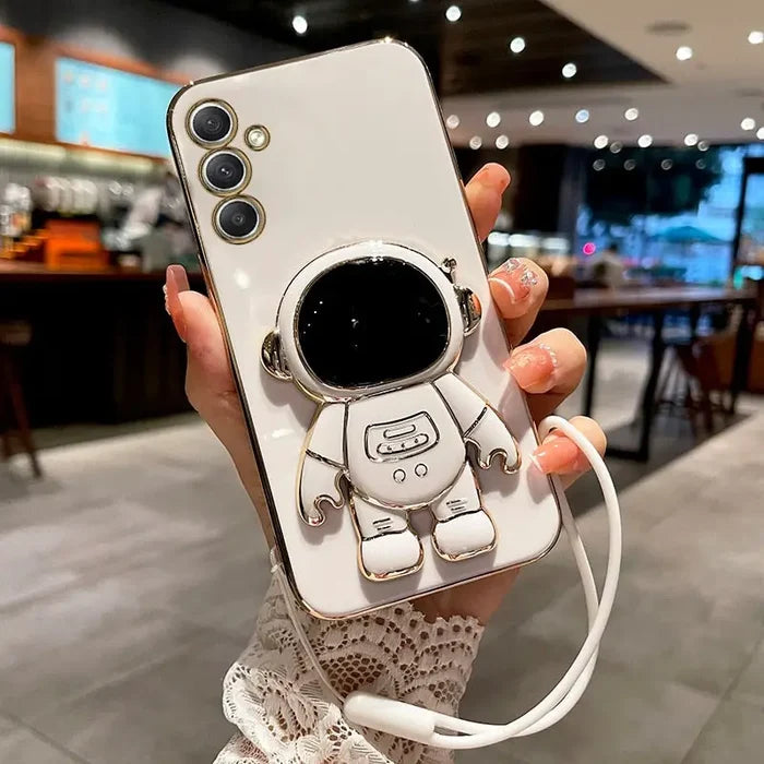 a person holding a cell phone case with a camera attached to it