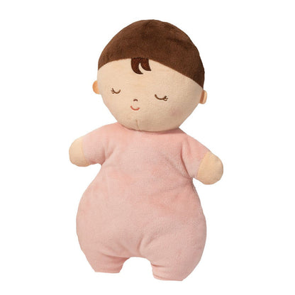 Plush toy baby doll with brown hair and pink outfit on a white background