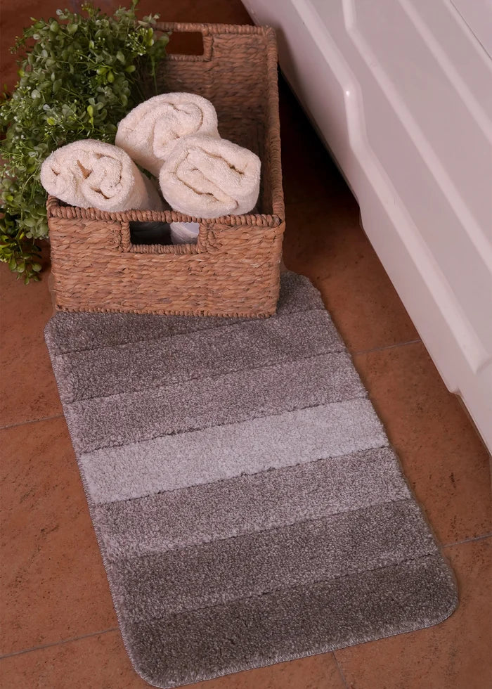 Black bath mat, rectangular with textured stripes and rounded corners