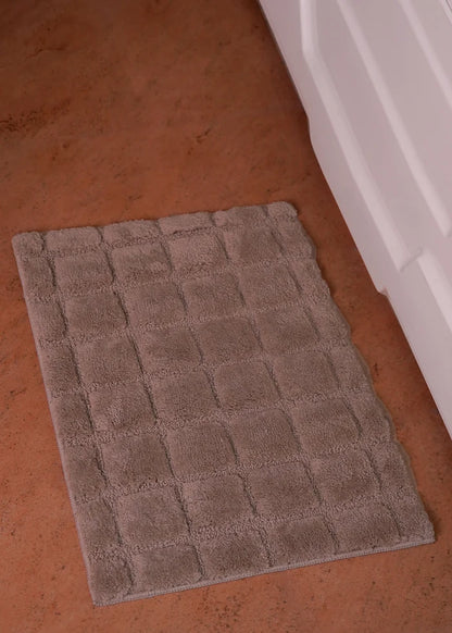 Brown bath mat with square textured loop grid pattern