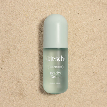 Kitsch Beachy Gelato Hair Perfume 50mL bottle on sandy background – cruelty-free beachy hair scent