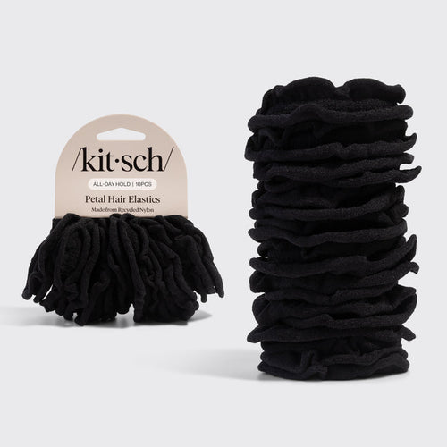 Black petal hair elastics with 'Kitsch' packaging on a light gray background