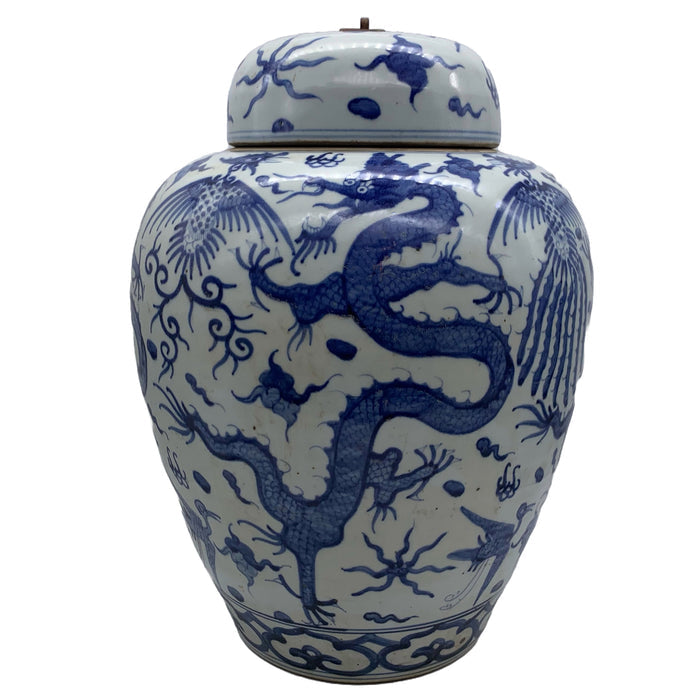 Blue and white lidded ceramic ginger jar with dragon motif.