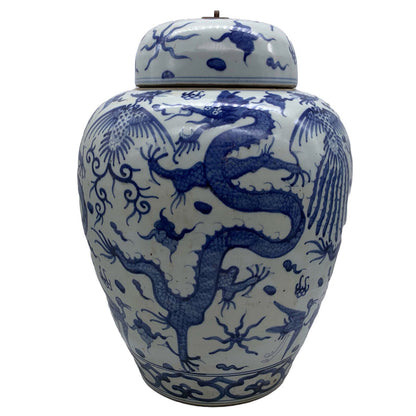 Blue and white lidded ceramic ginger jar with dragon motif.
