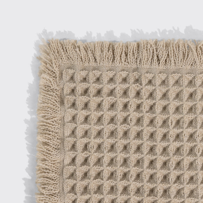 KITSCH Camel Quick-Dry Bath Mat — close-up of the corner showing the woven texture and fringed trim — High-quality, durable material withstands regular use — a spa-inspired touch for your daily routine