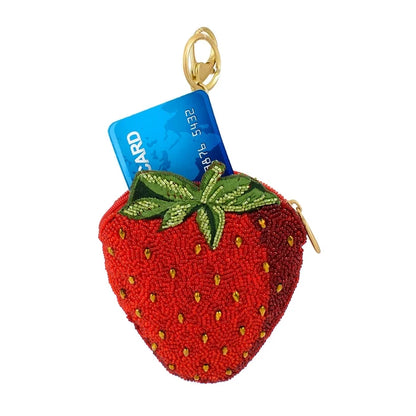 Strawberry-shaped keychain with a card inside on a white background