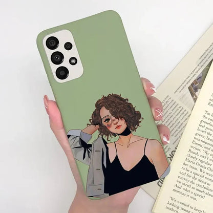 a woman holding a book and a green phone case