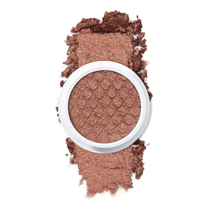 ColourPop Deep Dive Super Shock Shadow, a metallic bronze‑brown single eyeshadow in a white pot with a scale‑embossed surface, sits with crushed shimmer pigment swatched above and below on a white background, showcasing its ultra‑glitter finish.