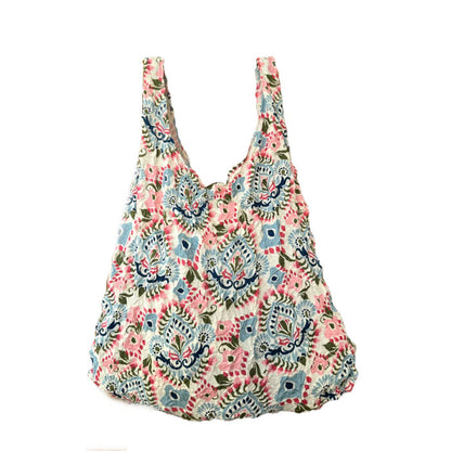 Floral patterned reusable bag on a white background