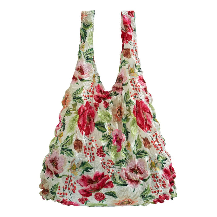 Floral patterned reusable bag on a white background