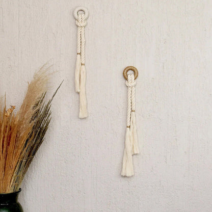 Two handcrafted wall decor featuring natural cotton fiber rope with a color accent of jute,