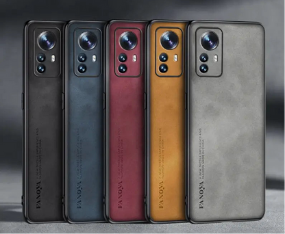 Five smartphones in different colors with prominent camera arrays.