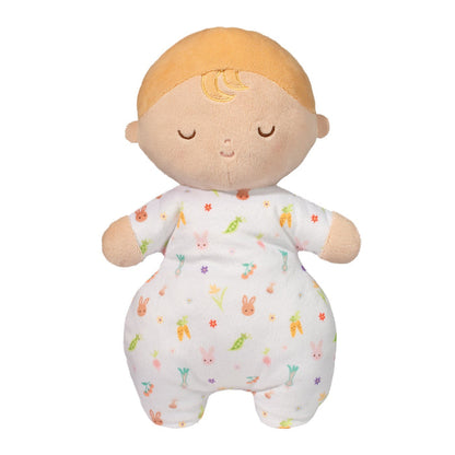 Plush toy baby doll with blonde hair and a patterned outfit on a white background