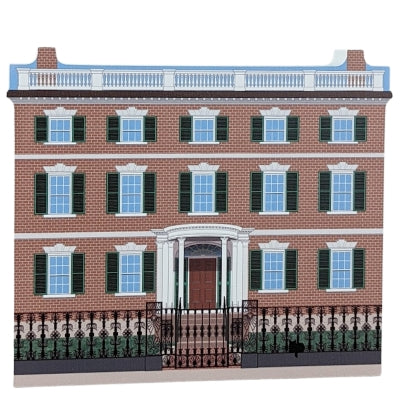 A decorative wood block of the Gardner-Pingree House with informative text on the reverse.