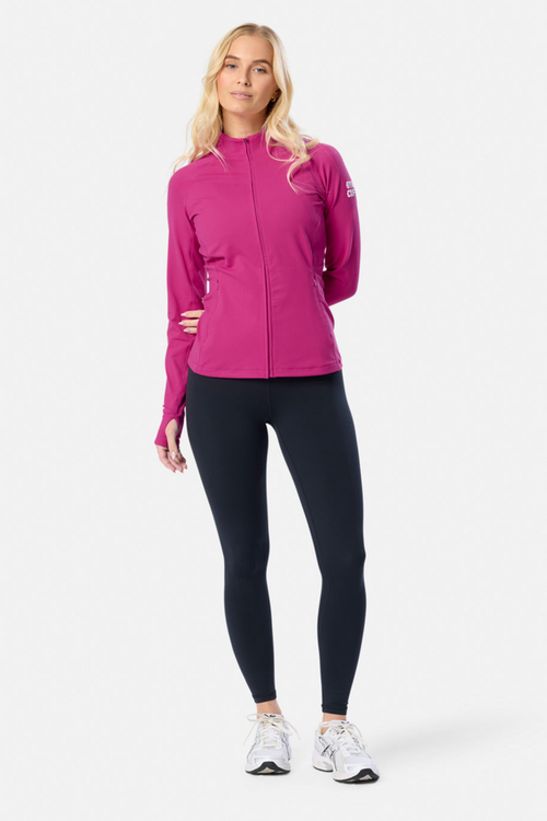 Gym+Coffee Relentless Full Zip Jacket in sunrise pink with four-way stretch and zipped pockets. A breathable, slim-fit layer for everyday wear. Shop at Dotique.