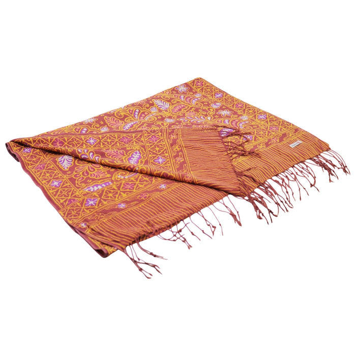 Patterned orange scarf with fringes on a white background