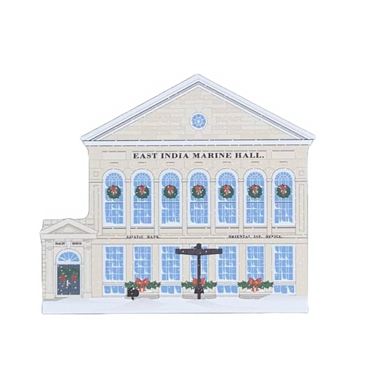 A miniature replica of the East India Marine Hall in Salem, Massachusetts, decorated for the holidays with Christmas wreaths on the windows.