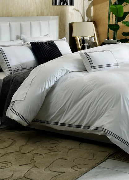 White duvet cover with dark gray and black striped pillow shams