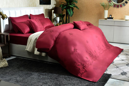 Red embroidered comforter set with matching pillowcases