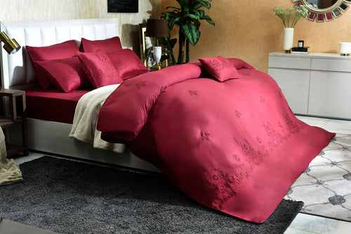 Red embroidered comforter set with matching pillowcases