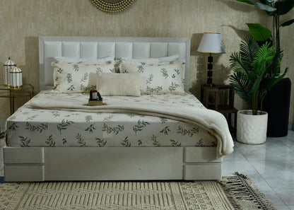 Cotton sateen bed sheet set with green leaf pattern and matching pillowcases