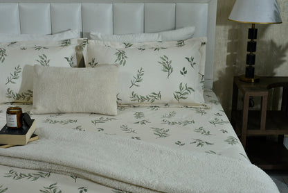 Cotton sateen flat sheet and pillowcases with scattered green leaf print
