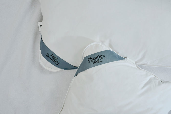 White duck feather pillow with Cherone HOME label on fabric seam