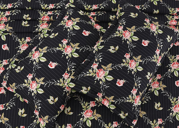 Black cotton pillow cover fabric close-up with dense floral vine diamond pattern