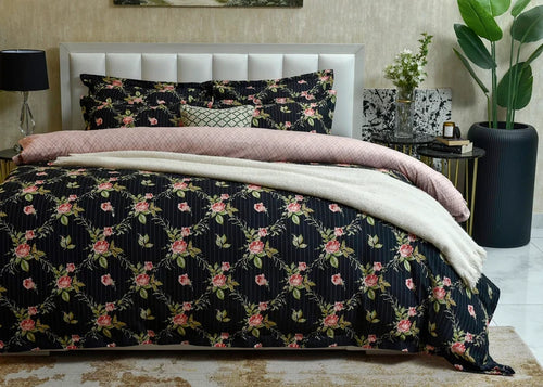 Black floral quilt cover with pink roses and thin white stripes, with matching pillow cases