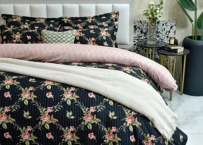 Black quilt cover featuring pink rose floral and thin white stripe lines, with folded duvet