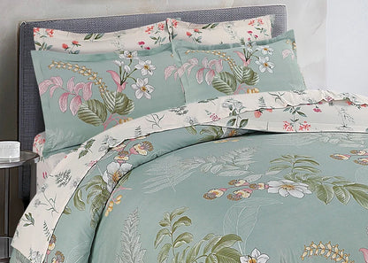 Cotton quilt cover in light teal and cream with tropical floral leaf print