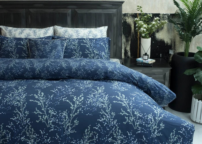 Navy Lucent cotton comforter and shams with pale botanical sprig pattern