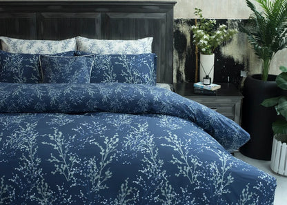Navy Lucent cotton comforter and shams with pale botanical sprig pattern