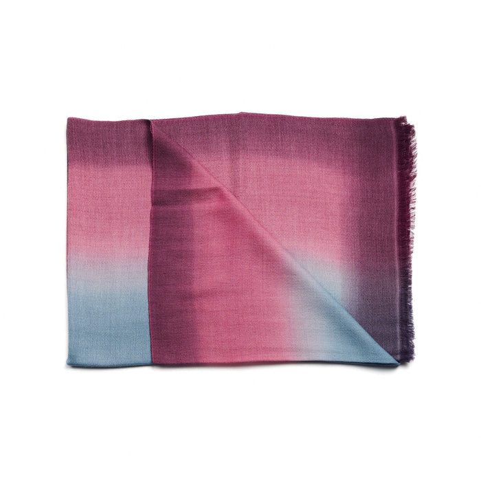 Gradient scarf transitioning from pink to blue on a white background