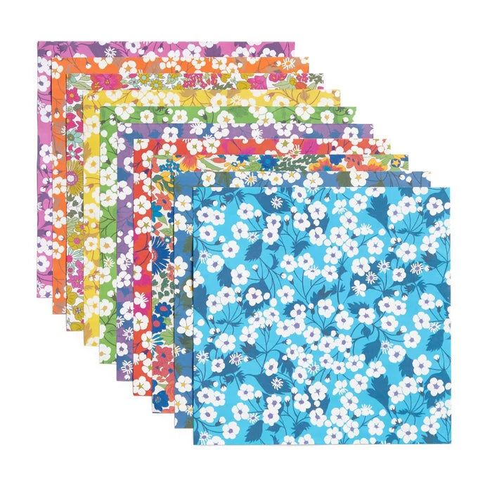 Set of colorful floral-patterned paper sheets on a white background