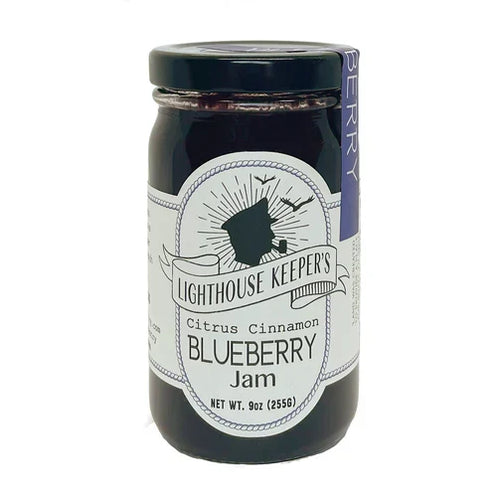 A jar of Lighthouse Citrus Cinnamon Blueberry Jam with a white label that includes the product name and a silhouette of a lighthouse.