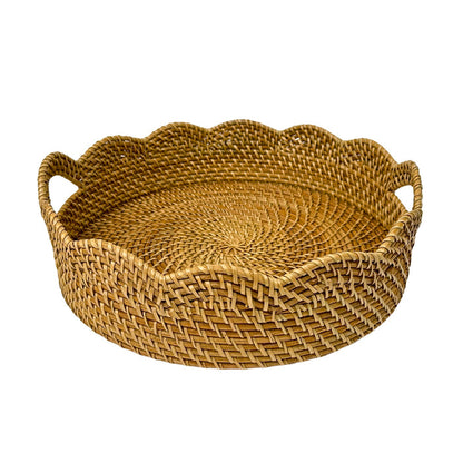 Woven rattan tray with scalloped edge and handles on a white background
