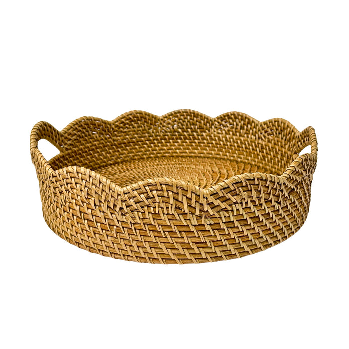 Woven basket with scalloped edge on a white background