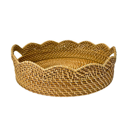 Woven basket with scalloped edge on a white background