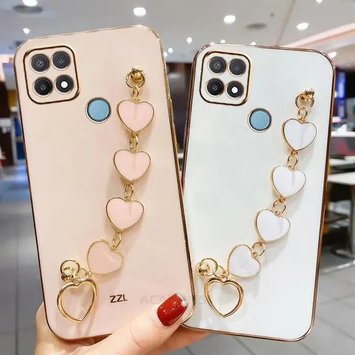 two phone cases with heart charms