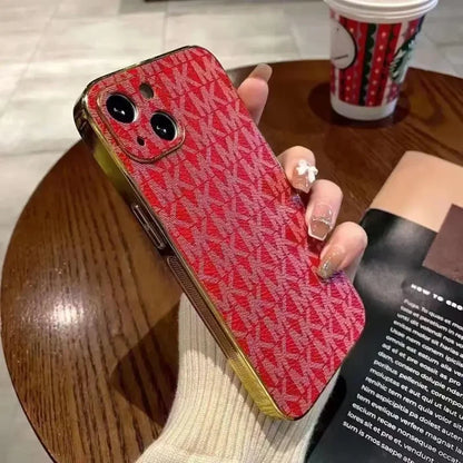a woman holding a red phone case