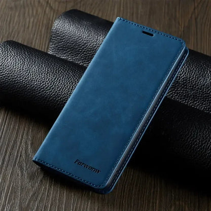 the back of a blue leather case on a wooden table