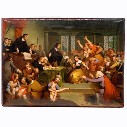A magnet depicting a historical scene of the trial of George Jacobs, with various figures seated and speaking in a courtroom setting.