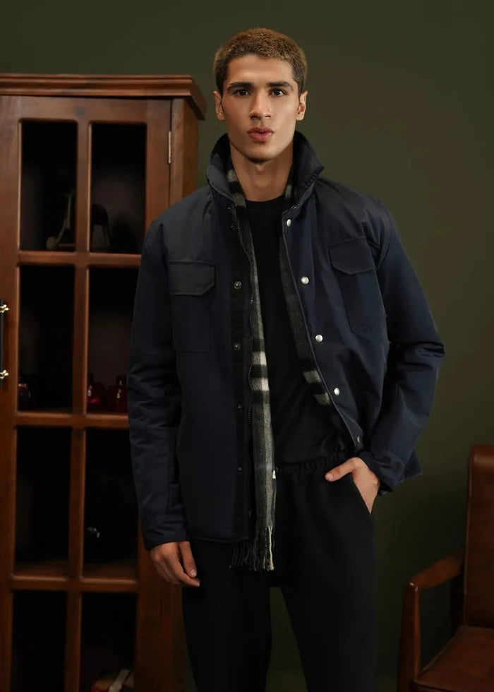 Men's navy hooded memory jacket with snap buttons and chest flap pockets.