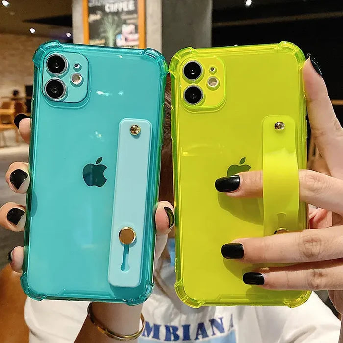 two women holding up their iphones