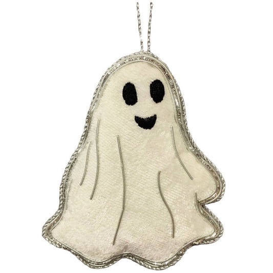 A handmade sheet ghost ornament with silver metallic applique on white velvet, featuring a smiling face and a loop for hanging.
