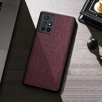 the back of a red iphone case on a desk